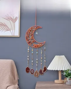 Detail of moon shaped tree of life wall hanging with agate slices and crystals