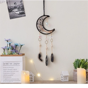 Moon-shaped dream catcher with white crystal gravel and hanging agate slices decor