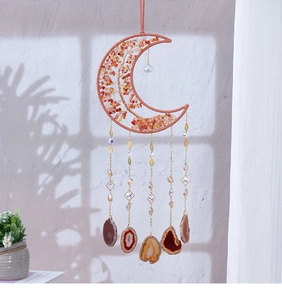 Detail of crescent moon wall hanging with wire wrapped tree of life and agate slices