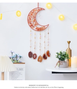 Macro detail of crescent moon tree of life wall hanging with natural agate slices