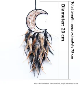 Detail view of moon shape dreamcatcher with life tree crystals and natural feathers