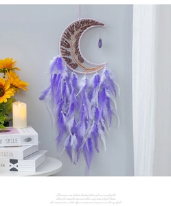 Detail of purple moon dream catcher featuring life tree crystal and gradient feathers