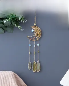 Detail of golden moon dream catcher with tree of life and natural agate stone pendants