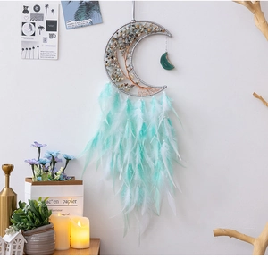 Detail of mint green and white moon dreamcatcher with gemstone tree of life wall decor