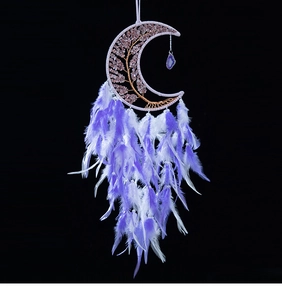Macro shot of moon-shaped dream catcher with amethyst tree of life and purple feathers