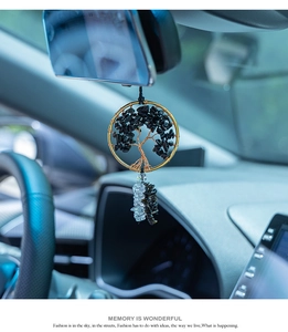 Macro view of Tree of Life car mirror hanging ornament with obsidian and metal wire