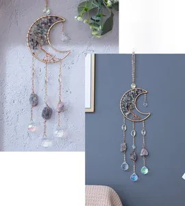 Detail of moon-shaped suncatcher with Tree of Life wire wrap and natural gemstones
