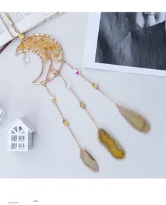 Detailed view of handmade golden moon suncatcher with Tree of Life and agate slices