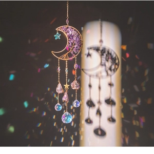 Detail of amethyst moon suncatcher with tree of life design and rainbow light effects