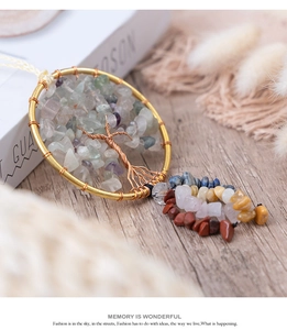 Detailed close-up of handmade Tree of Life wall hanging with natural gemstone crystals