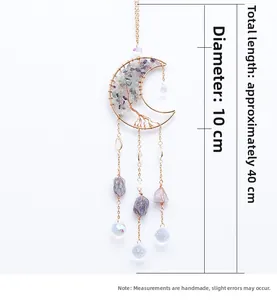 Detailed view of handmade moon-shaped tree of life suncatcher with crystal stones