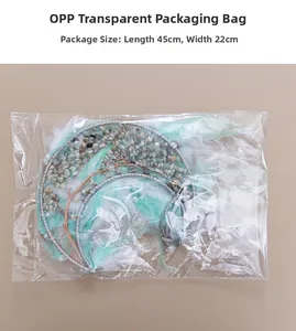 Moon-shaped tree of life pendant with mint green feathers and OPP packaging 45x22cm