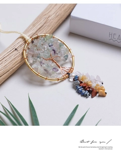 Detail of handmade Tree of Life wall hanging with colorful natural stones on wood