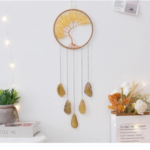 Detailed view of handmade Tree of Life wind chime with agate slices and yellow crystals