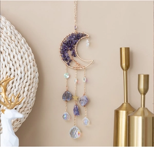 Detail of amethyst moon sun catcher with golden wire tree of life and crystal ball prisms