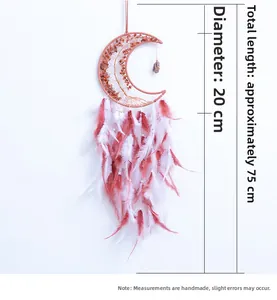 Detail of pink crystal moon dreamcatcher with feathers and decorative bead accents