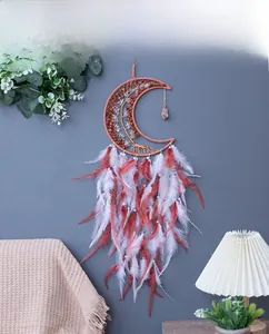 Bohemian moon dream catcher detail with life tree wire work and soft red white feathers
