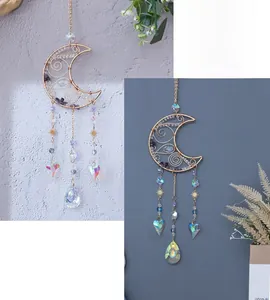 Detail of amethyst crescent moon suncatcher with golden wire wrap and crystal heart drops