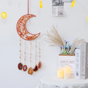 Moon-shaped tree of life wall hanging with orange crystals and agate slices for home decor