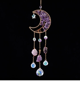 Detail of amethyst tree of life moon sun catcher with hanging crystal prism ball