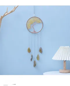 Detailed view of Tree of Life wall decor with yellow crystals and agate slices hanging