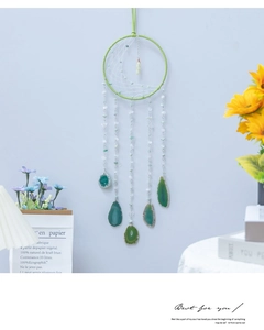 Detail of bohemian moon dreamcatcher with green agate stones and hand-woven macrame