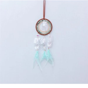 Detail of bohemian dreamcatcher car charm with turquoise stones and mint feathers