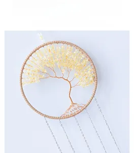 Detail of life tree wall hanging with yellow crystal stones and bronze wire weaving