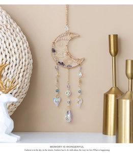 Detail of amethyst moon sun catcher with gold wire wrap and crystal heart prisms