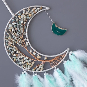 Moon-shaped Tree of Life dreamcatcher wall hanging with natural stones and blue feathers