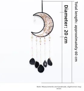 Detail view of crescent moon dreamcatcher with crystal tree of life and black agate slices
