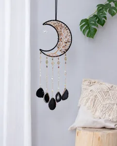 Detail of bohemian moon tree of life wall hanging with black agate and brown stones