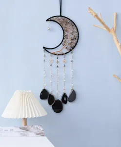 Detail of moon dream catcher with tree of life wire art and black agate slices