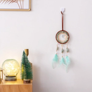 Handmade dream catcher wall hanging with green feathers and turquoise beads decor