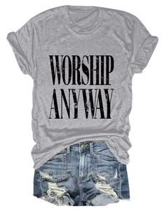 Close-up of WORSHIP ANYWAY vintage print on grey t-shirt with distressed denim shorts