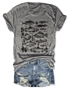 Close-up of gray cotton T-shirt featuring artistic fish illustrations and distressed denim shorts