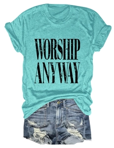 Detailed flat lay of mint green T-shirt with black text and distressed denim shorts