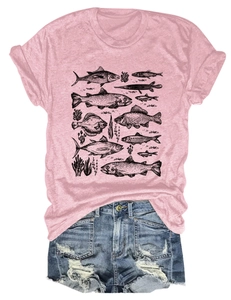 Detail of pink t-shirt with black fish and coral illustrations paired with denim shorts