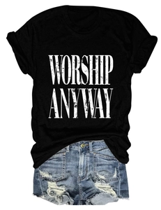 Detail of WORSHIP ANYWAY print on black cotton T-shirt with distressed denim shorts