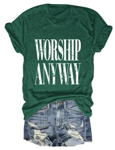 Flat lay of dark green T-shirt with WORSHIP ANYWAY slogan and distressed denim shorts