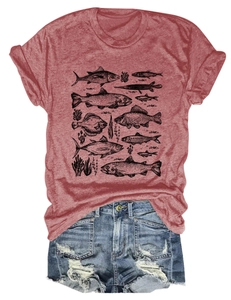 Detail of red fish print t-shirt paired with distressed denim shorts for summer