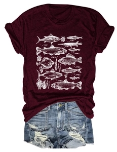 Detail of burgundy T-shirt with white fish and coral print paired with blue denim shorts