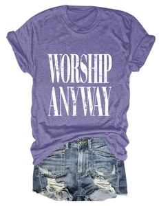Flat lay of purple 'Worship Anyway' cotton t-shirt and distressed denim shorts outfit