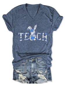 Detailed view of the TEACH blue floral bunny print on a women's V-neck cotton T-shirt