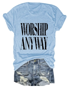 Flat lay of light blue T-shirt with black Worship Anyway text and denim shorts