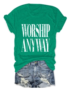 Detail of green t-shirt with Worship Anyway print and distressed denim shorts