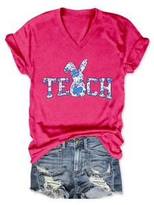 Detailed flat lay of rose pink V-neck t-shirt with blue floral rabbit TEACH print