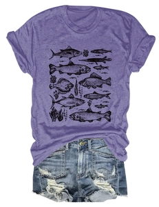 Close-up of a purple T-shirt with fish illustration and distressed denim shorts