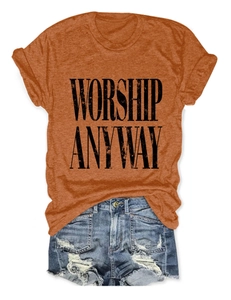 Flat lay detail of cotton t-shirt with Worship Anyway print and denim shorts with frayed hems