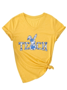 Close-up of ginger yellow V-neck T-shirt with TEACH letter and floral bunny print
